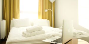 A clean, modern bedroom with sleep tracking technology, representing a restful home environment.