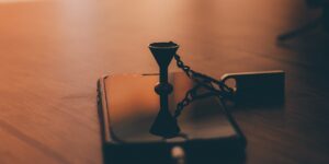 A smartphone resting in a wooden box, symbolizing a digital break.