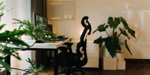 A minimalist, organized home study desk setup with warm lighting.