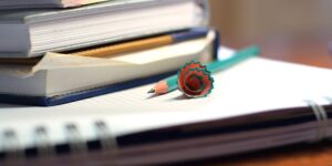 A focused study environment with books and stationery on a desk.