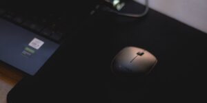 A professional setup for repairing wireless computer peripherals on a desk.