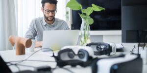 Professional setting up a remote work station for the future of global employment.