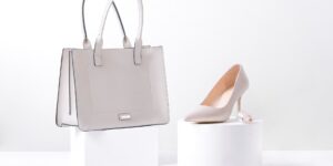 A sophisticated, minimalist closet displaying a single luxury handbag on a shelf.