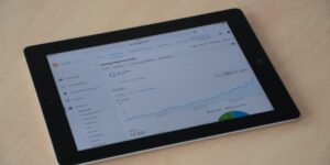 A modern tablet showing a family chore dashboard on a desk.