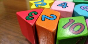 Modern colorful building blocks on a wooden table representing toy industry changes