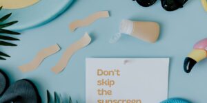 Flat lay of intergenerational travel essentials for hot climates