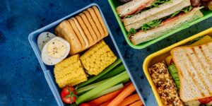 A balanced and visually appealing school lunchbox designed for sensory engagement.
