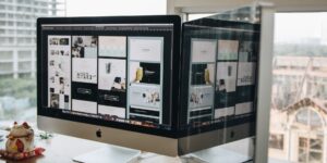A modern home office setup with a digital logistics interface representing global supply chain monitoring.