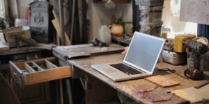 A creative workspace for a family history project with old photos and markers.