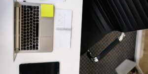 A clean desk setup with a tablet and notebook representing organized family planning.