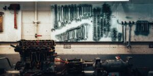 A well-organized garage wall featuring a variety of power tools, representing the concept of a shared tool library.