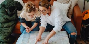 A family planning a weekend trip on a tablet in a calm, organized living room.