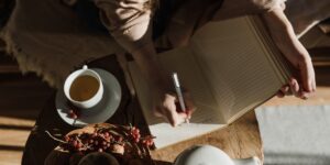 A peaceful morning scene with a notebook and tea, symbolizing a digital reset.