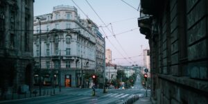 A quiet, peaceful street scene in a major city, capturing the essence of slow travel.