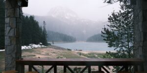 A peaceful, minimalist cabin view overlooking a forest, perfect for a quiet getaway.