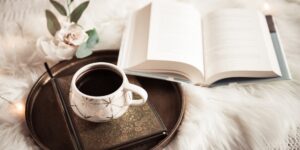 A cozy, inviting scene of a book club meeting setup on a coffee table.