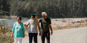A family enjoying a slow-paced hike on a gentle forest trail.