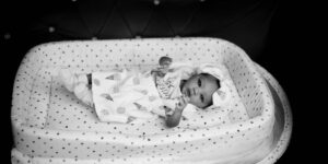 A modern, high-end nursery setup with premium baby gear in a sunlit room.