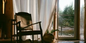 A peaceful, sunlit living room representing a calm staycation environment.