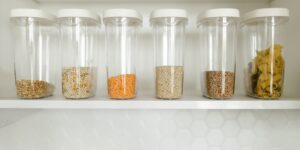 Modern organized home pantry shelf with household goods