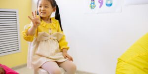 A child learning about emotions with a visual chart.