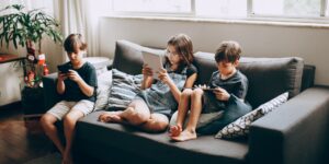 A family interacting with technology in a modern home environment