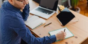 A professional working in a modern home office preparing for international tax changes.