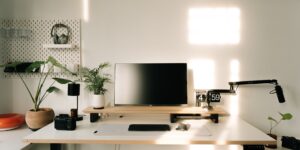 A sleek, modern modular desk setup in a bright home office space.