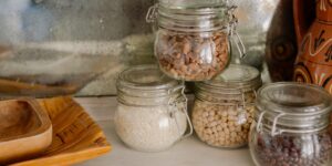 A clean, well-organized kitchen pantry filled with staples, representing smart food management.