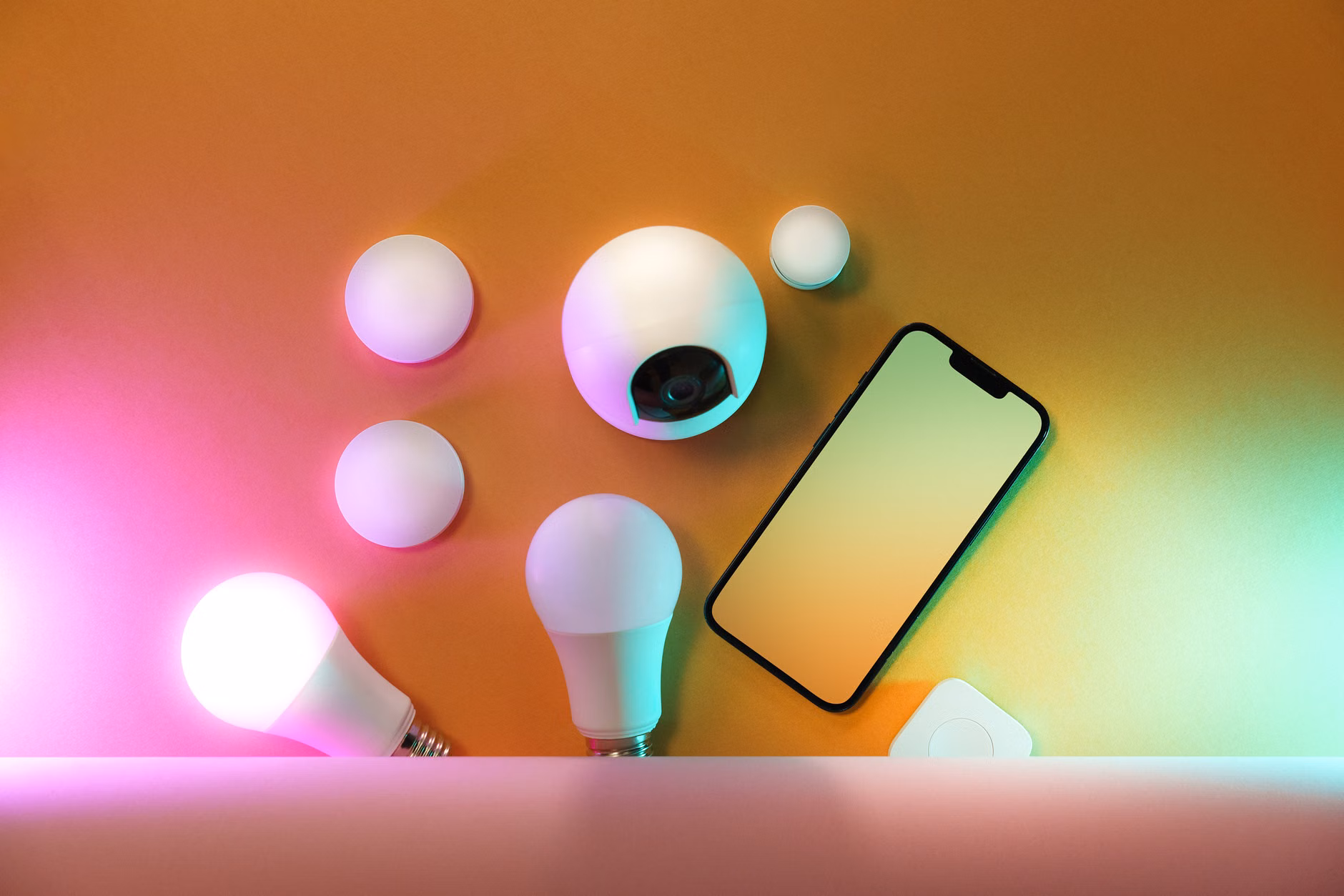 Person controlling smart lighting with a smartphone
