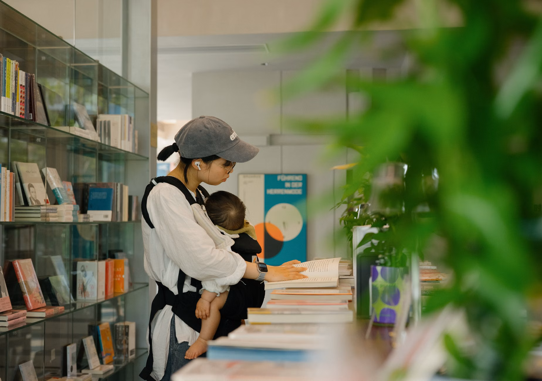 A parent and child exploring tools at a community library.