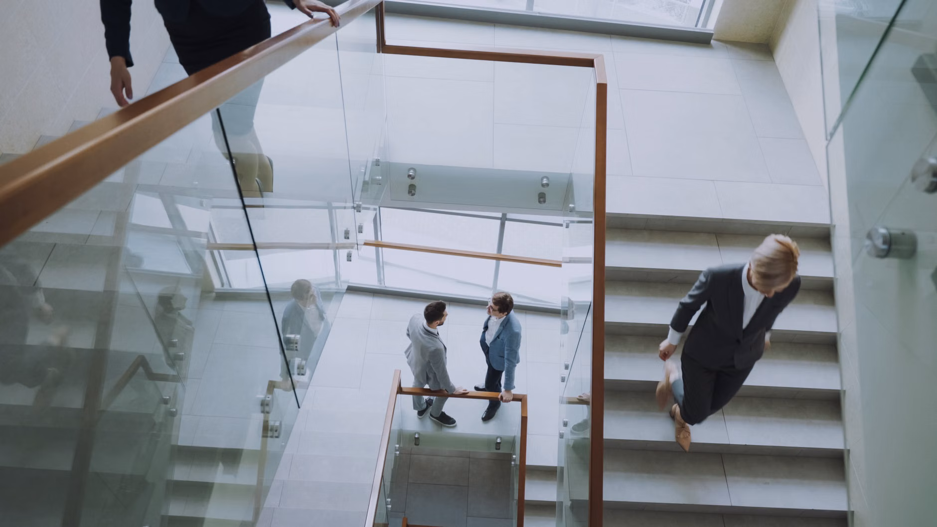 Neighbors talking in a modern apartment lobby