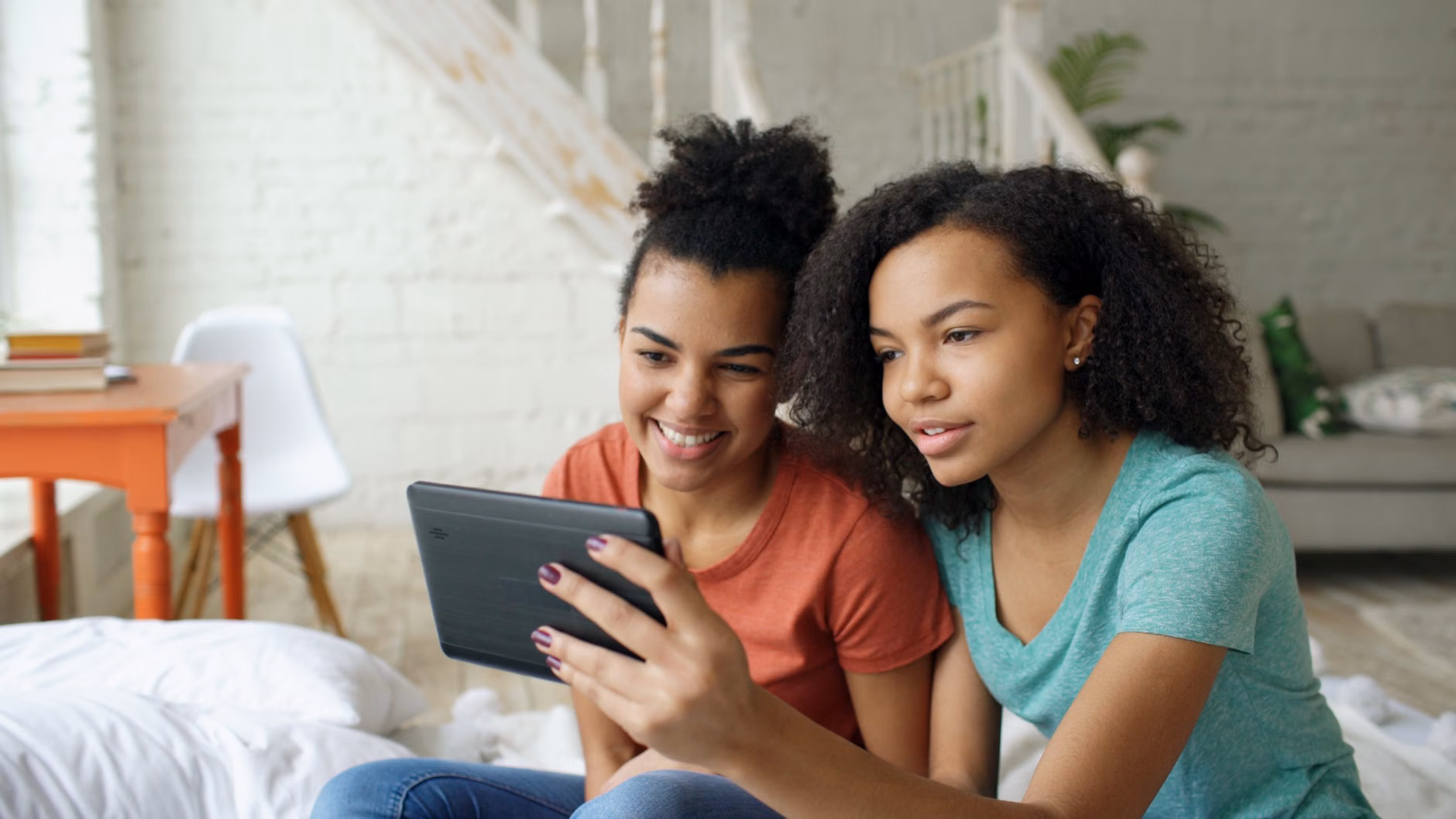 Parent and teen reviewing a shared digital calendar.