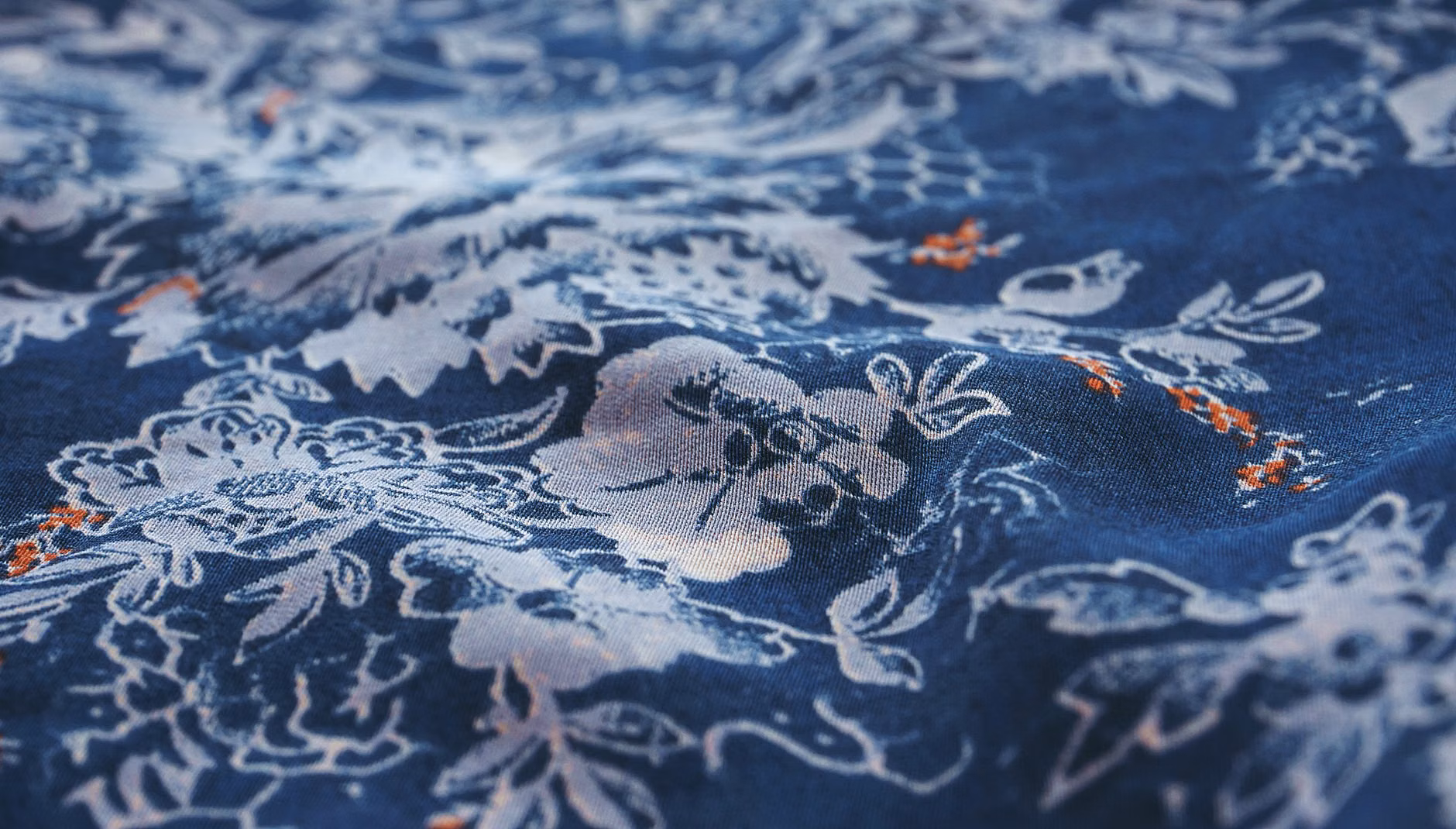 Detail shot of high-quality vintage designer fabric texture.