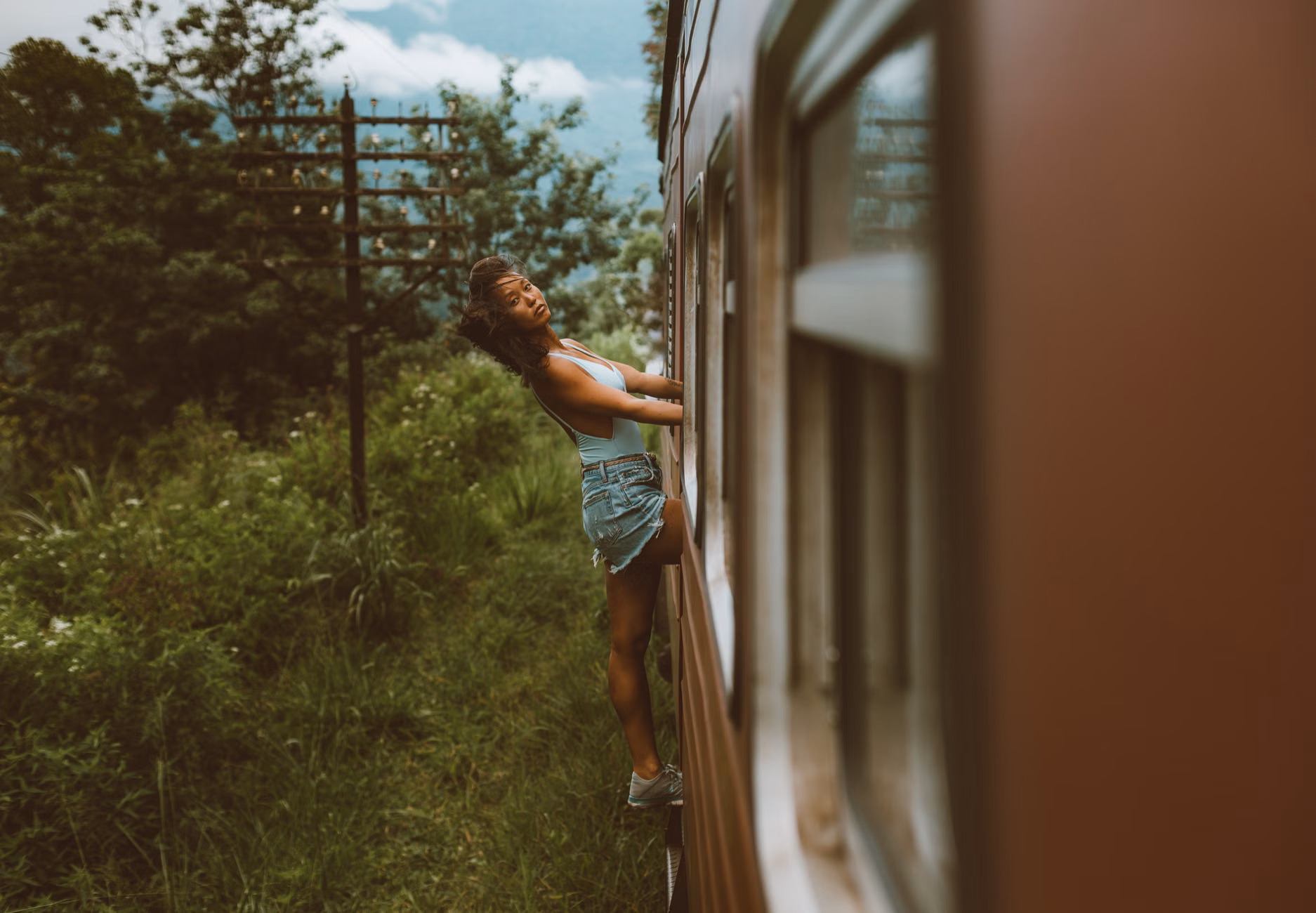 A family enjoying the view from a restored vintage train carriage.