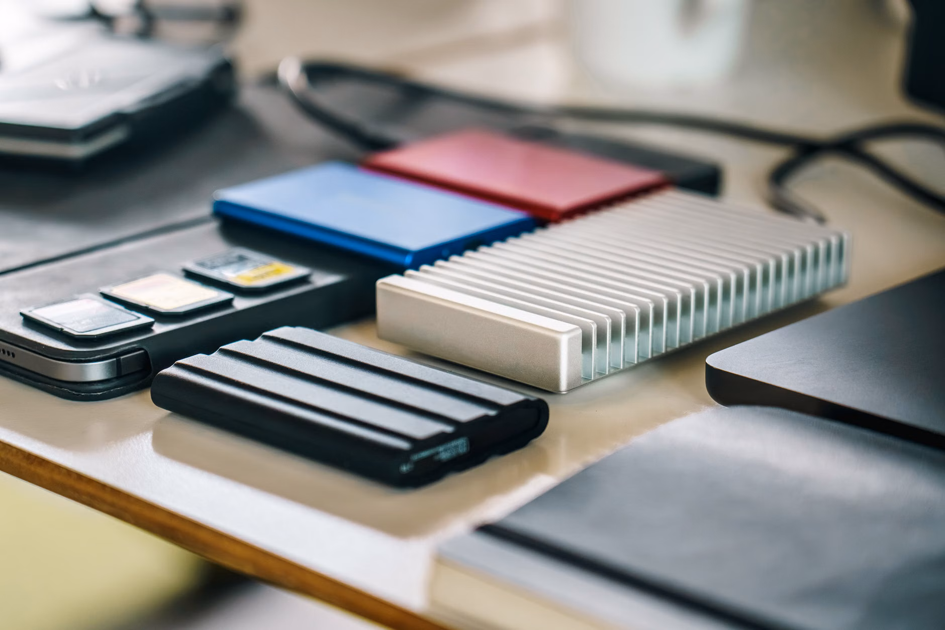 Connecting a portable SSD to a laptop for local data backup.