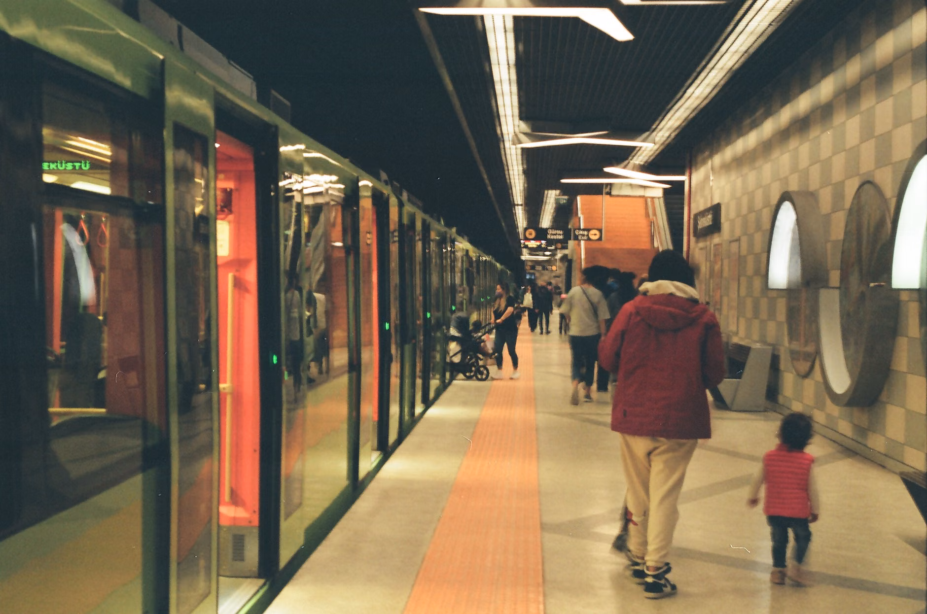 A family preparing for a night journey on a train.