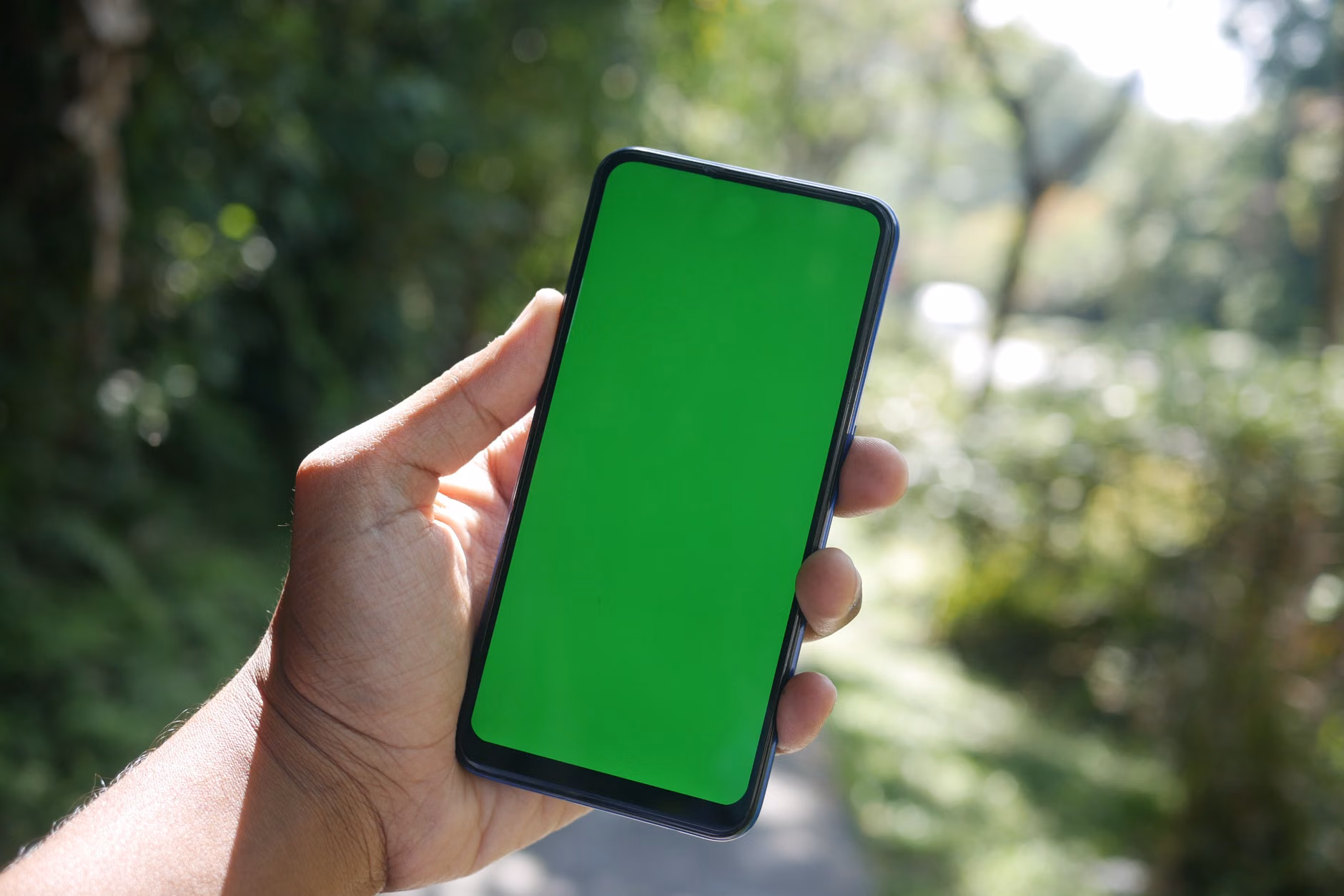 Smartphone displaying a digital voucher for an outdoor nature park experience.