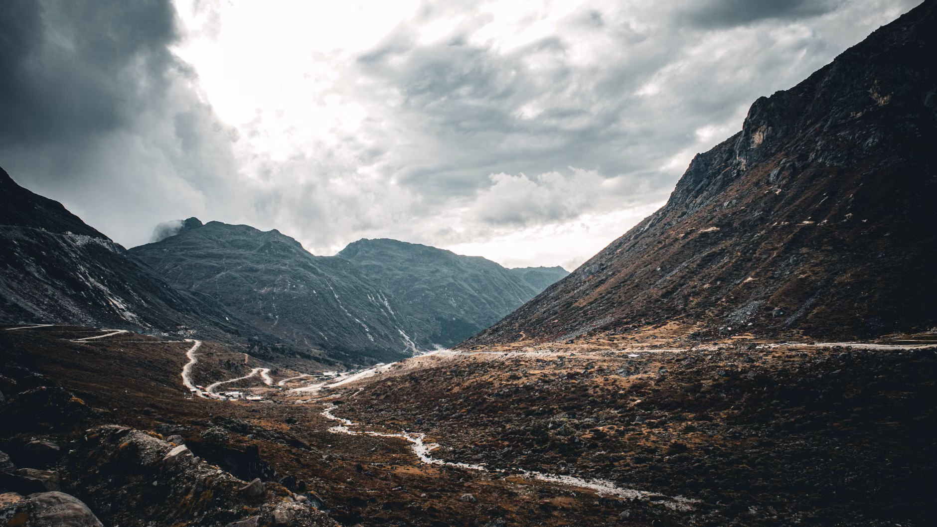 A scenic view of a remote mountain pass for hiking navigation.