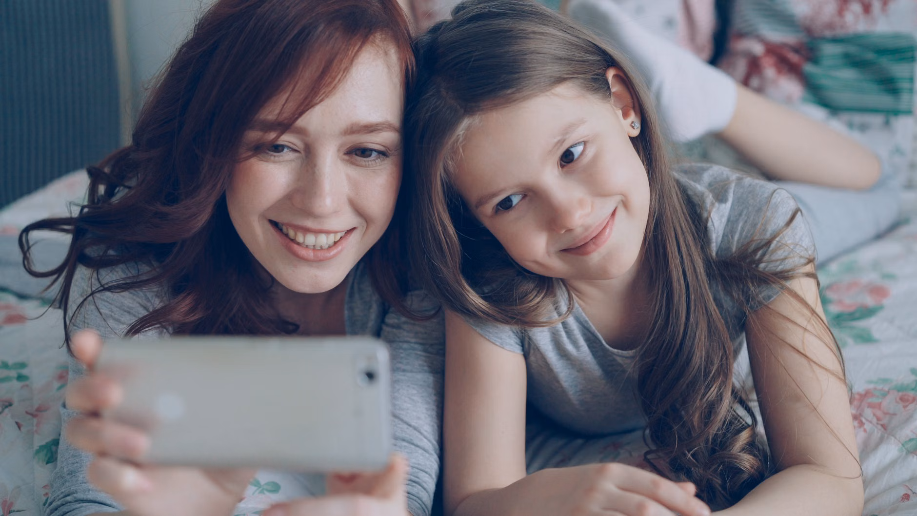 A parent sharing digital family history with their child.