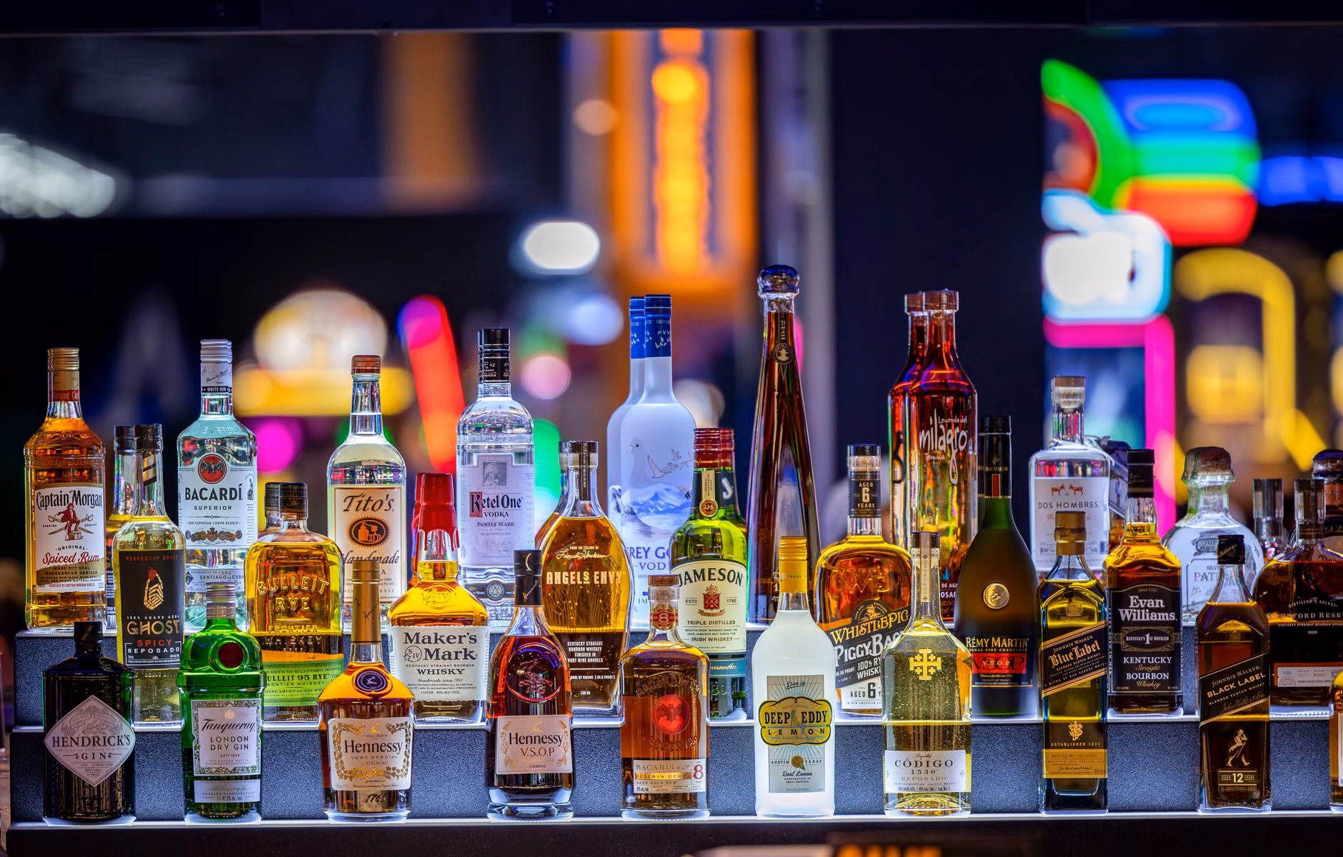 A selection of premium zero-proof spirits on a store shelf.