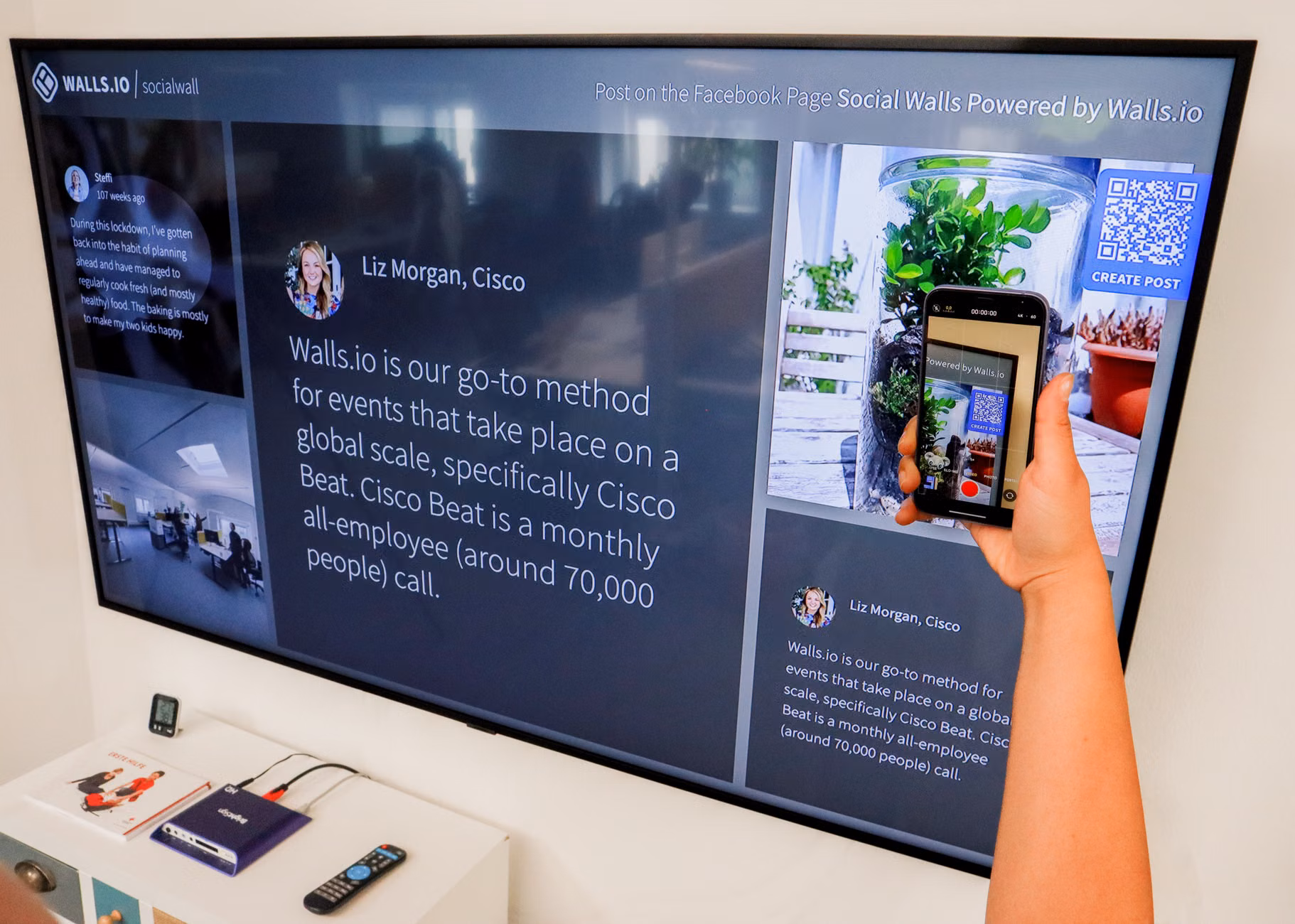 A wall-mounted smart screen displaying a color-coded family activity calendar.