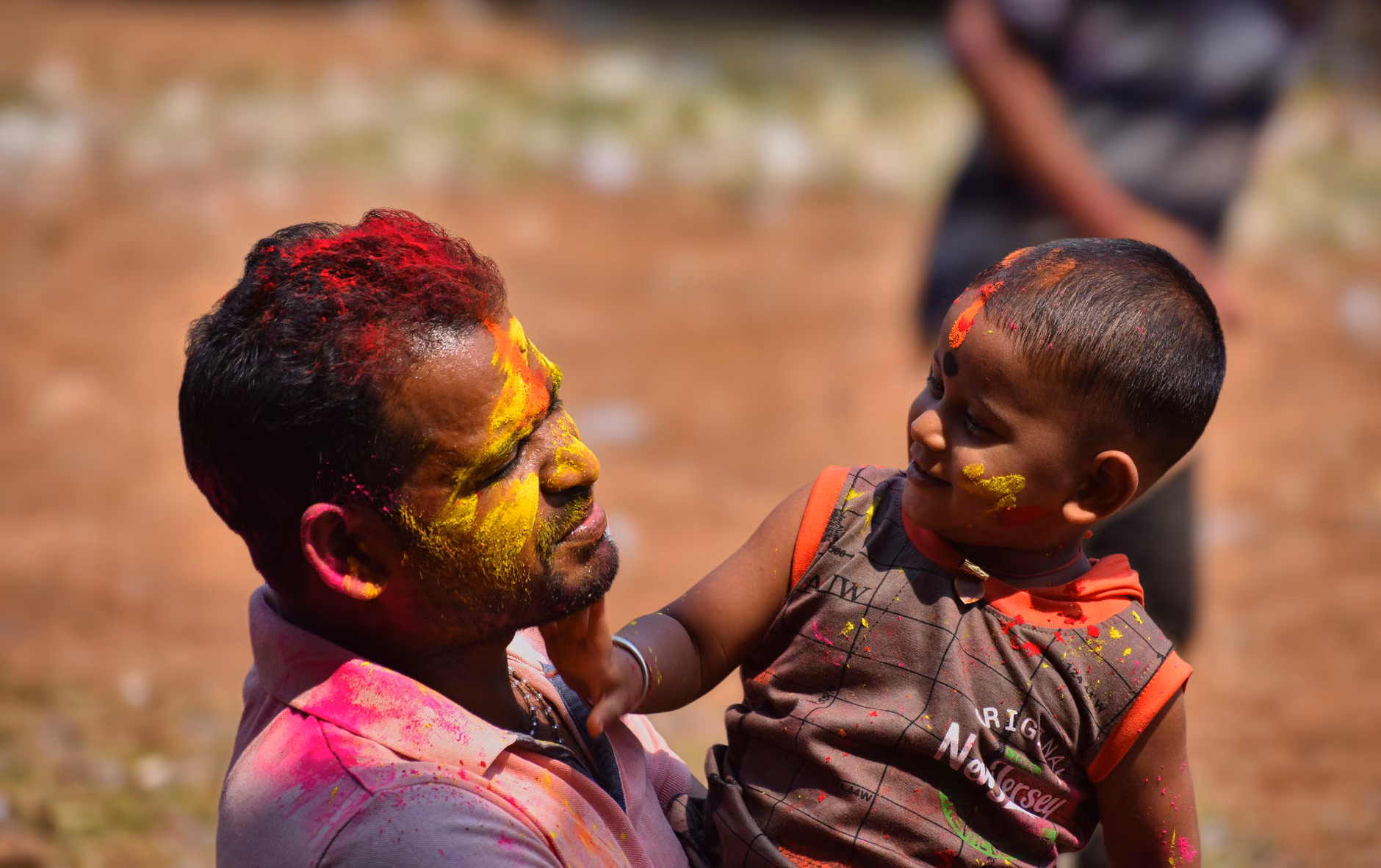 Father and son sharing a positive moment in front of a mirror.