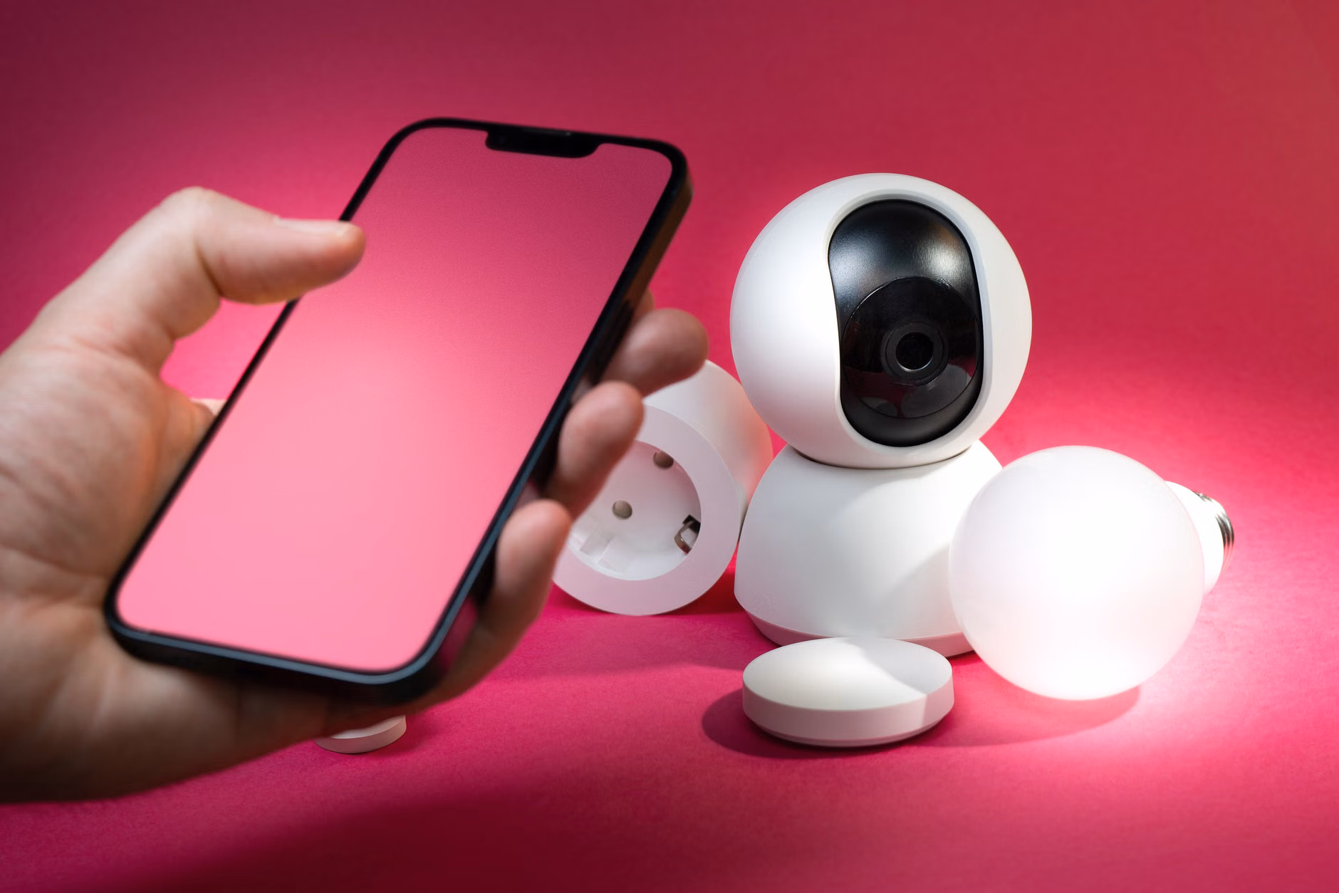 A parent monitoring home security via a smartphone app.