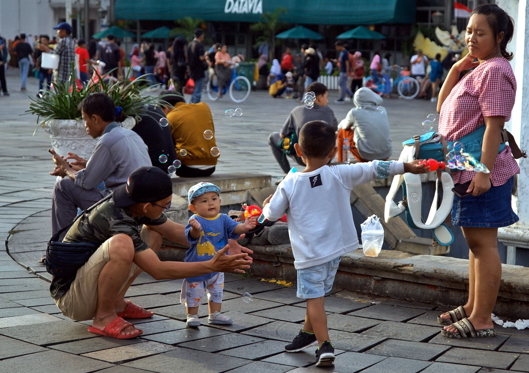 Parents socializing in an outdoor public space designed for community interaction.