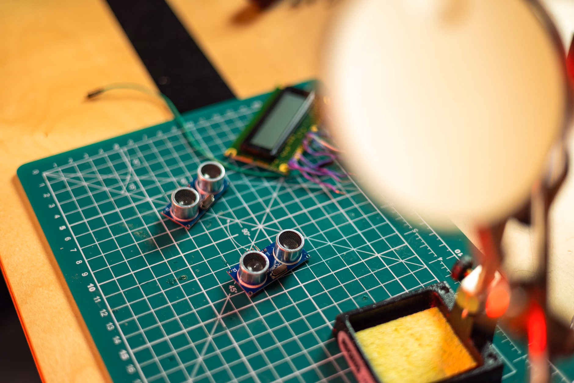 A well-equipped DIY electronics workspace for building smart home sensors.
