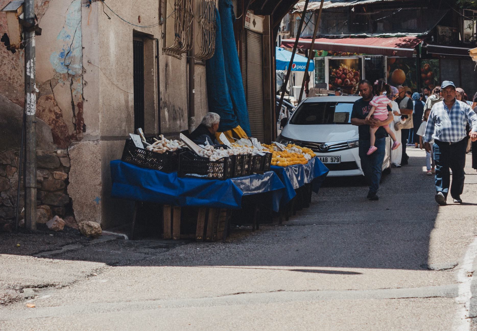 A family exploring a local market in a foreign country.