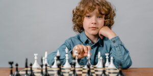 A child playing with a mix of traditional and smart toys in a bright living room.