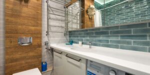 A bright, modern laundry room setting representing smart home energy management.