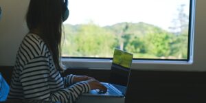 A family enjoying the scenic view from a comfortable train cabin.